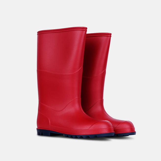 A pair of red Classic Wellies are angled, highlighting their vibrant colour and sturdy design with navy blue soles.